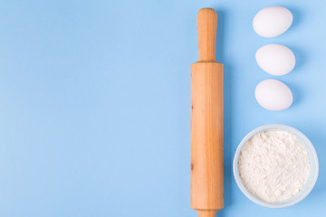 Ingredients for baking  on a blue background.