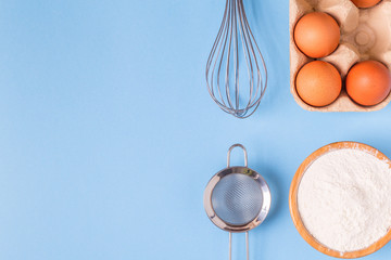 Ingredients for baking  on a blue background.