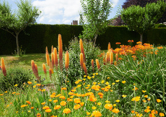 Flower gardens at the historic medieval grounds and buildings of Penhurst Place.