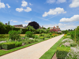Flower gardens at the historic medieval grounds and buildings of Penhurst Place.