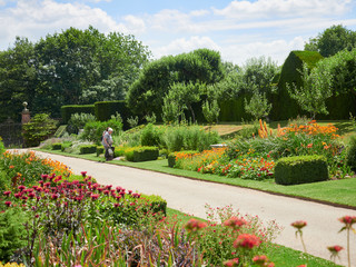 TONBRIDGE, ENGLAND, UK - JULY 01, 2017: Tourists Flower gardens at the historic medieval grounds...