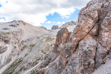 Wild rocky scenery with a view of the top of the mount Cristallo, Cortina d'Ampezzo, Dolomites, Italy
