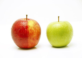 A picture of two apples standing next to each other 