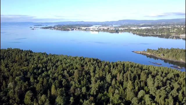 Aerial footage from drone over trees on Bygdoy, Oslo, Norway
