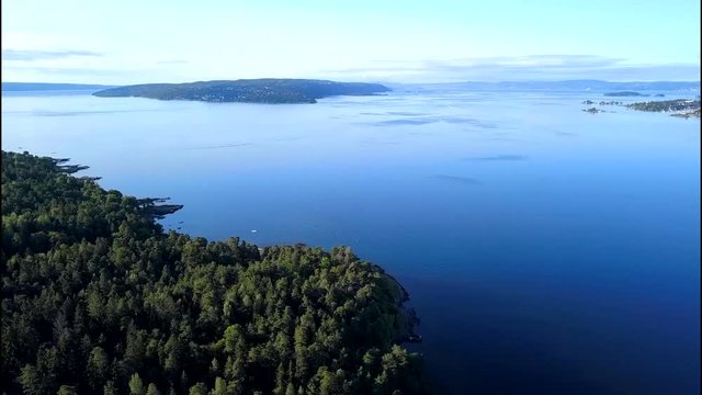 Aerial footage from drone over trees on Bygdoy, Oslo, Norway