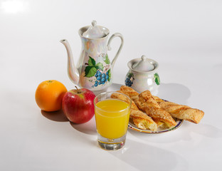 Breakfast with pastries, Apple and juice on white background.