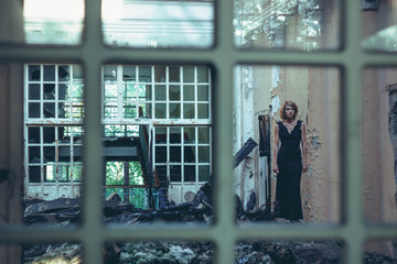 girl in a dress in an old house