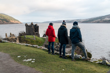 People admiring Urquhart castle, Loch Ness