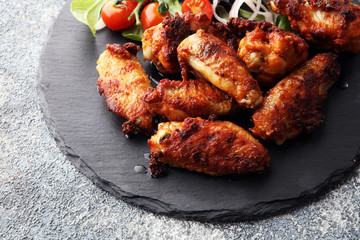 crispy barbecue chicken wings bbq on grey background