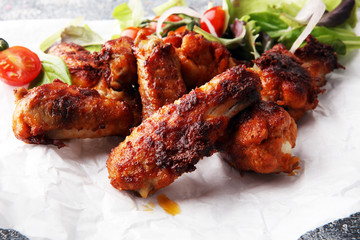 crispy barbecue chicken wings bbq on grey background
