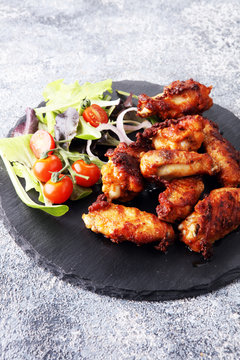 crispy barbecue chicken wings bbq on grey background
