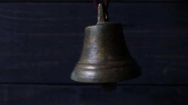 A bell on a dark background