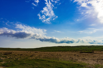 Fototapeta na wymiar Beautiful clouds on savannah fields