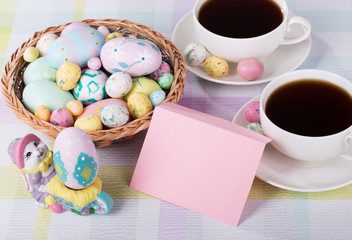 Above angle view of Easter decorations and envelope with coffee