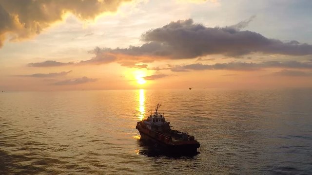 siluate offshore vessel at sunset with calm sea.mov