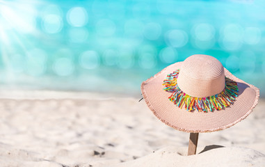 Hat Summer time at the beach with white sand beach and bokeh water