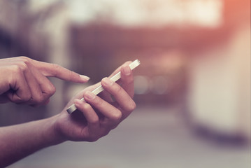 Closeup of man's hand using smartphone with copy space.