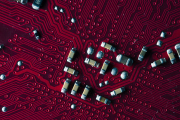 Macro picture of red printed circuit board - PCB