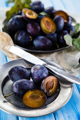 Plums on cutting board