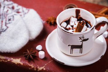 Hot Chocolate with Marshmallow candies. Warming holiday drink with cinnamon sticks . Warm Christmas.Winter Still Life in the Cup.
