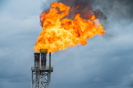 Fire on flare stack at oil and gas central processing platform while burning toxic and release over pressure from process.