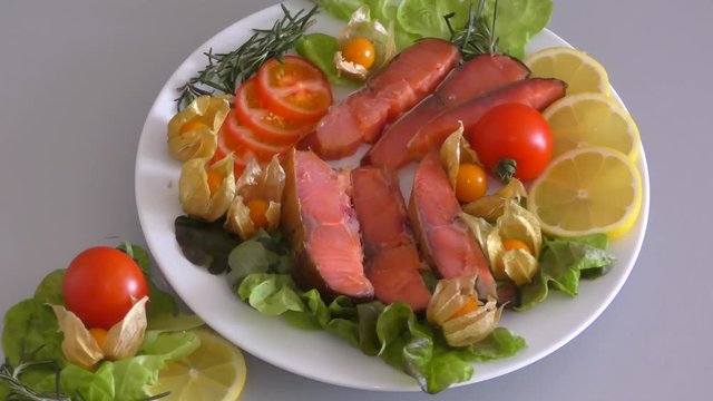 Chinook salmon (LAT. Oncorhynchus tshawytscha) smoked with fresh Greens and vegetables