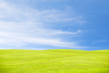 Green hill under the blue sky