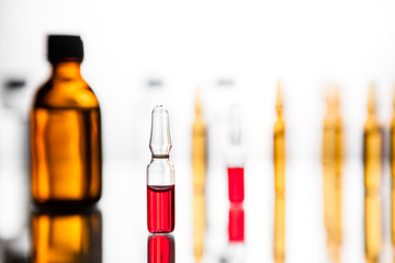 Group of ampoules with a transparent medicine in medical laboratory