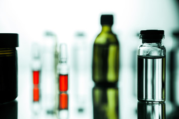 Group of ampoules with a transparent medicine in medical laboratory