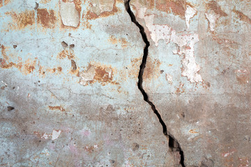 grunge plaster texture with crack and traces of paint