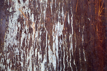grunge rusty metal texture with stains of white paint