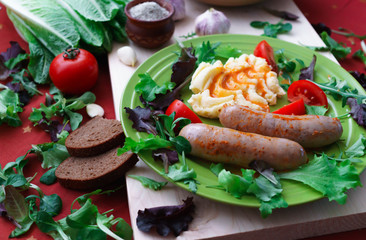 Home-made Pork Sausages along with mashed potatoes, poured with sweet paprika sauce.