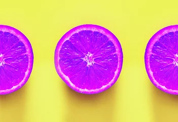 Surrealism. Violet oranges on yellow background © MagicsPhotos