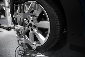 Tyre balancing of modern car in workshop