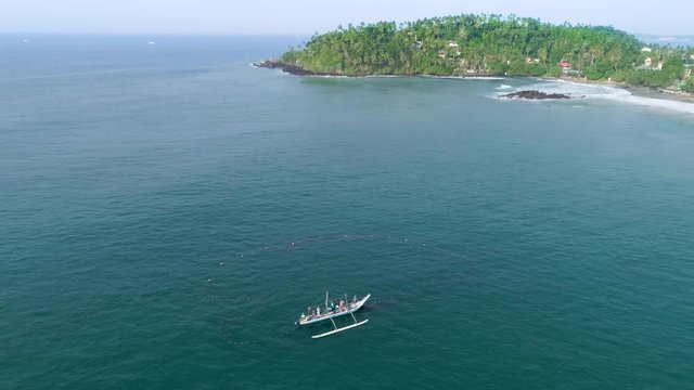 Aerial footage of fishermans at work in Sri Lanka. Slowmotion footage in 4k.