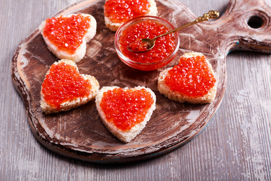 Red Caviar Over Heart Shape Bread