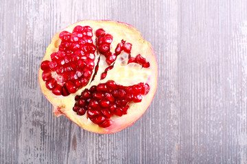 Pomegranate over wooden background