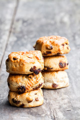 Homemade  sultana scones on wooden table