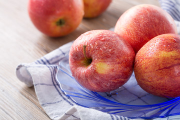 Fresh red apples with water drops