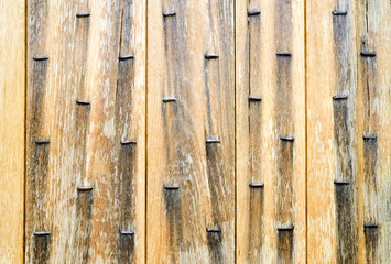 Old studded fortified wooden door detail
