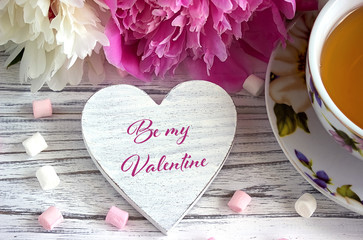Valentines day greeting card with peonies tea cup marshmallow and lettering be my Valentine.