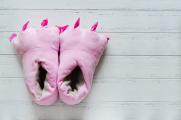 Pair of pink monster foot slippers