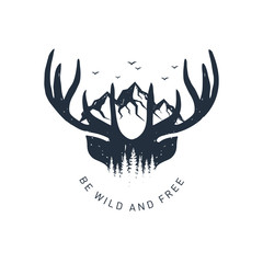 Hand drawn travel badge with deer antlers and mountains textured vector illustration and "Be wild and free" inspirational lettering.