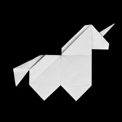 Handmade white origami unicorn on black background isolated