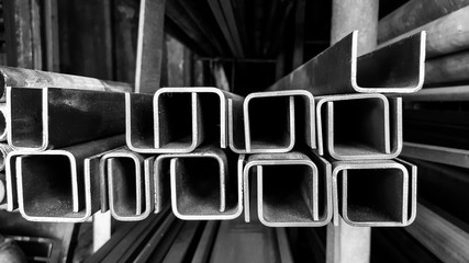 Construction steel profile pipe of C-Channel shape at the warehouse of steel products.