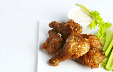 Fried chicken drumsticks and vegetables