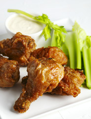 Fried chicken drumsticks and vegetables