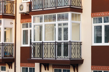Glazed balcony in a modern apartment building. - obrazy, fototapety, plakaty
