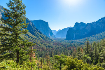 View of Yosemite Valley from Tunnel View point at sunrise - view to Bridalveil falls, El Capitan and Half Dome - Yosemite National Park in California, USA