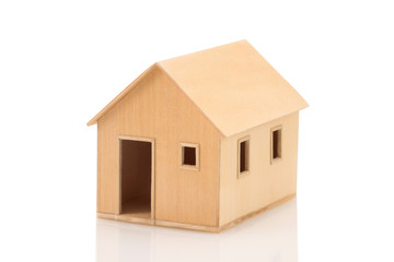 Toy wooden house model on white